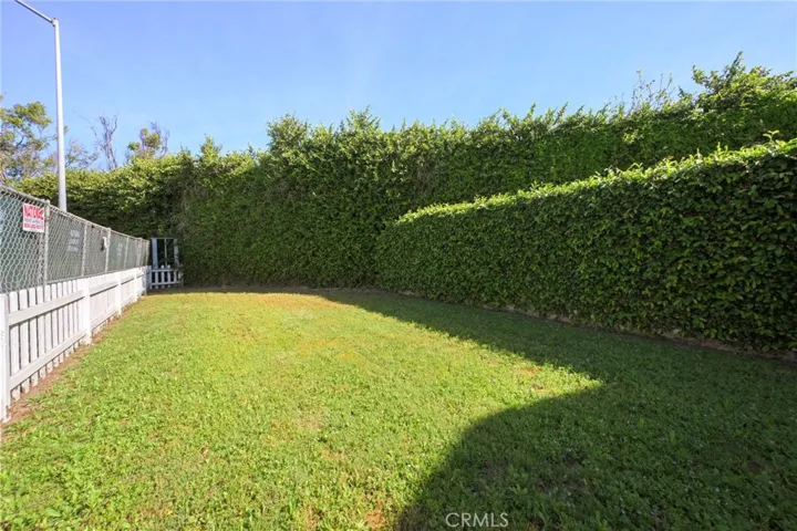 Large fenced front yard.