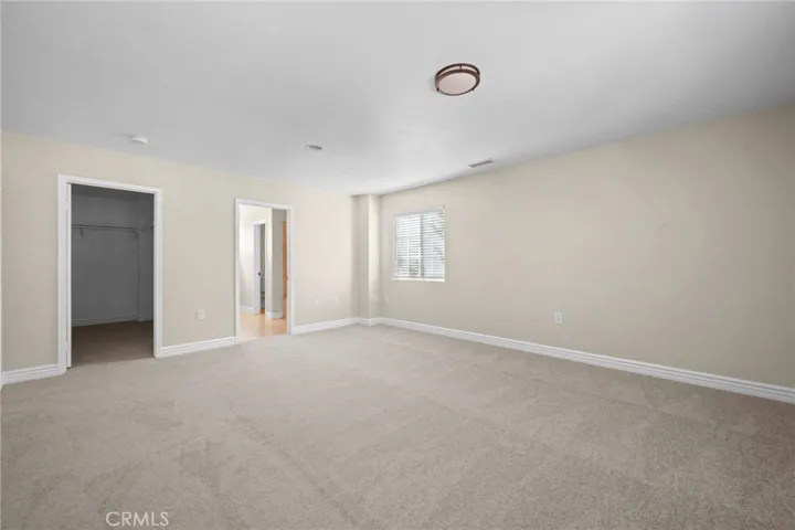 Main bedroom with large walk-in closet and private bath.