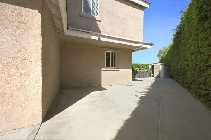 There is a large side yard with a shed.