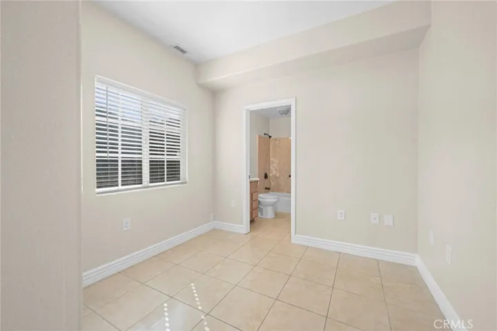 Bedroom #4 is downstairs with private bath-ideal for an older parent.