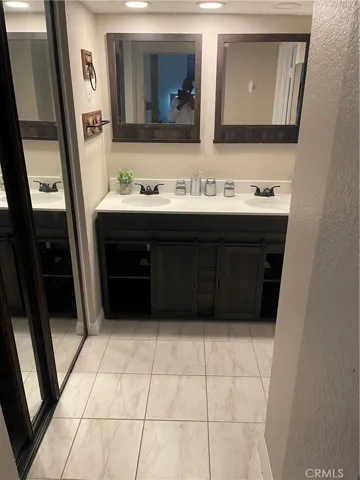 Master BR bath room with mirror closet doors