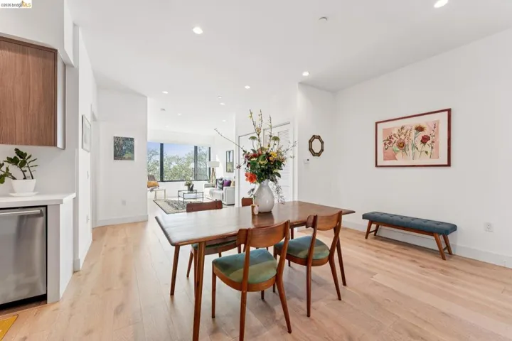 Dining area with recessed lighting and light wood-style flooring