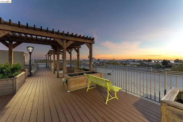 Wooden terrace featuring a pergola