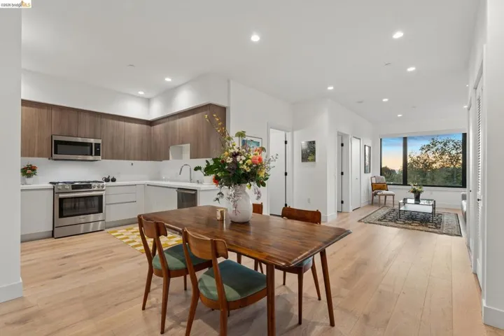 Dining space featuring light wood finished floors and recessed lighting