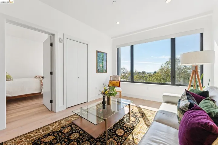 Living area featuring light wood-type flooring and recessed lighting