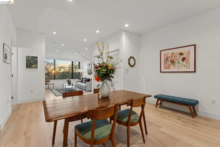 Dining space with light wood-style flooring and recessed lighting