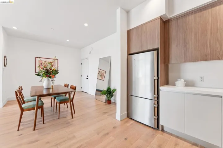 Dining space with light wood-type flooring and recessed lighting