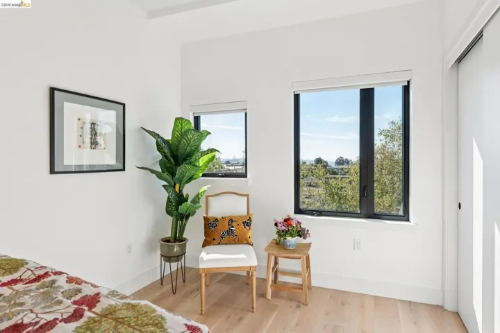 Bedroom featuring light wood-style flooring and baseboards