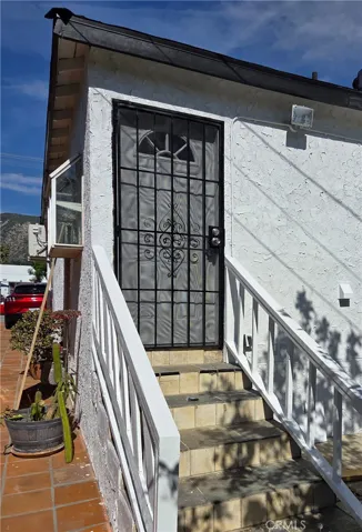 Security door at rear and handrails for safety.