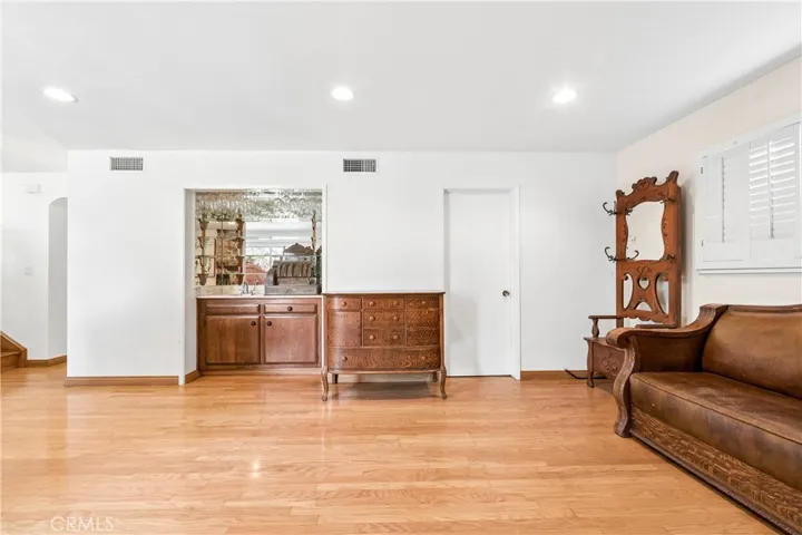 Den v view of Wet Bar and Door to Laundry Room