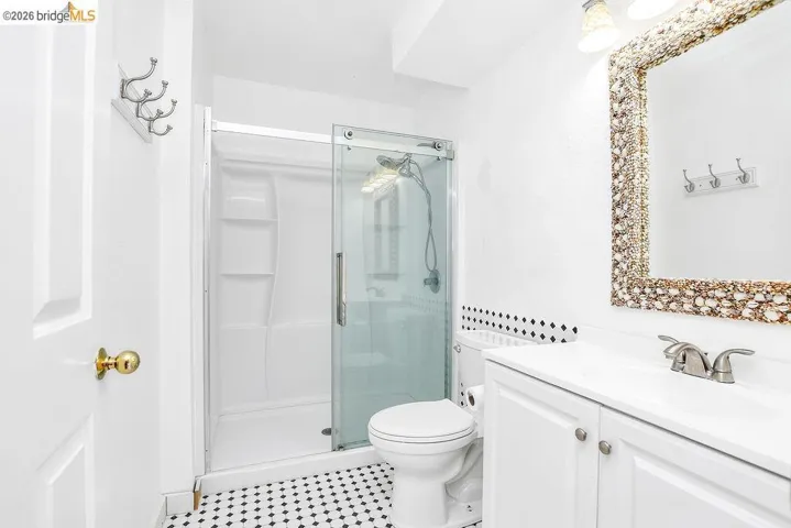 Full bath with vanity and a stall shower