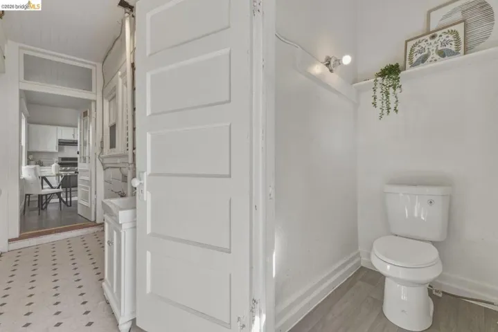 Half bathroom featuring toilet and vanity
