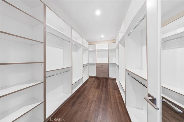 His and Her Walk in closet 1 with Custom cabinets