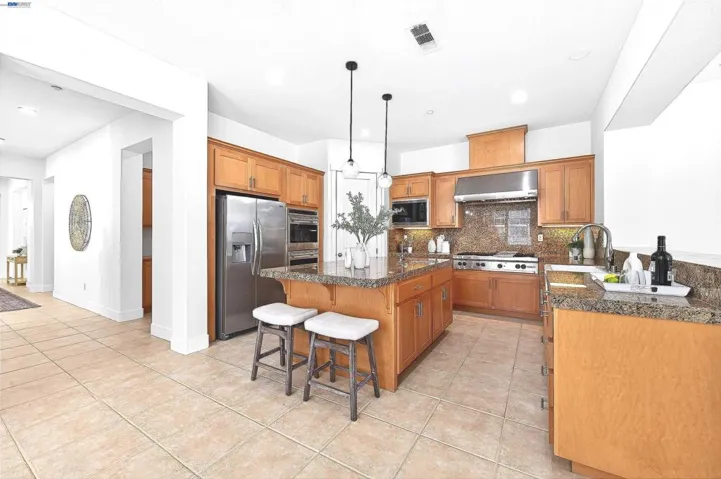 WITH ISLAND AND BAR SEATING