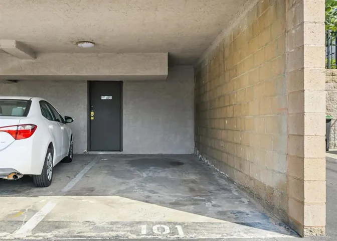 One assigned carport space and one unassigned, uncovered parking space