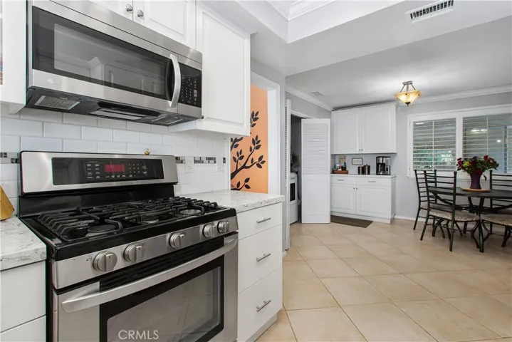 The kitchen has the same oversized ceramic tile from the entry and hallway. This room was completely rennovated in 2019.
