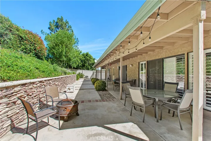 With access points from the family room, living room, dining room, and the primary bedroom suite, this space provides a true link between the indoor and outdoor living spaces.