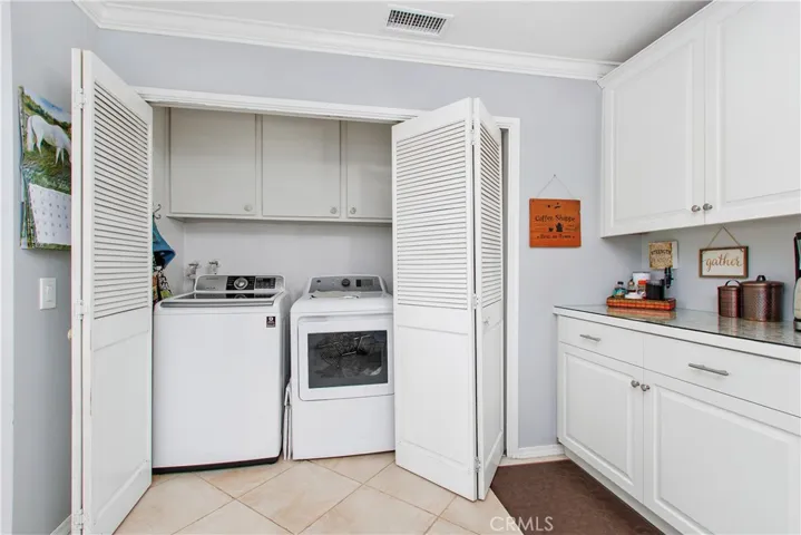 Behind the levolor doors is your laundry area. Plus additional storage.