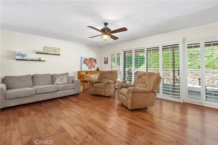 The large sliding door in the living room offers access to the back patio and also allows natural light into the space.