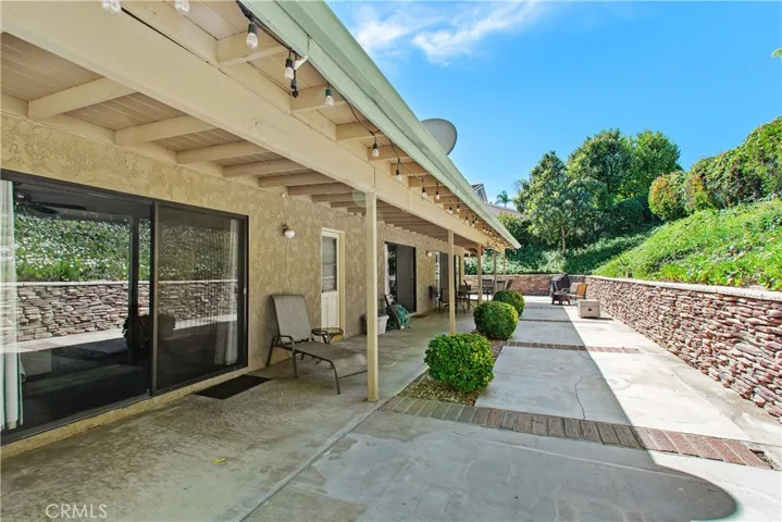 The primary bedroom end of the patio, looking toward the family and living room doors.