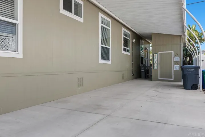 Spacious well maintained carport w/ beautiful storage