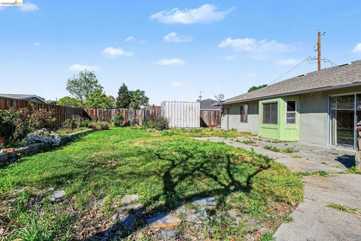 View of fenced backyard