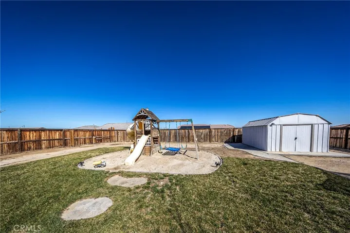 Backyard Playlet with Sandbox. Shed.