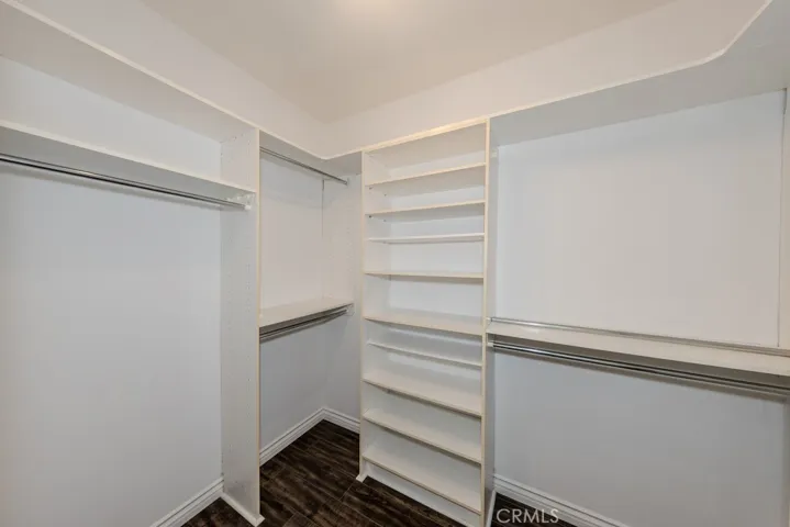 Primary Bedroom / walk-in closet with built-ins