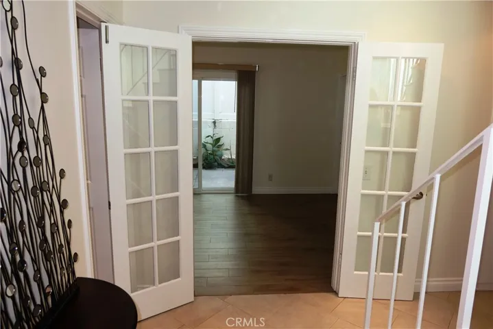 doors to downstairs bedroom off entry