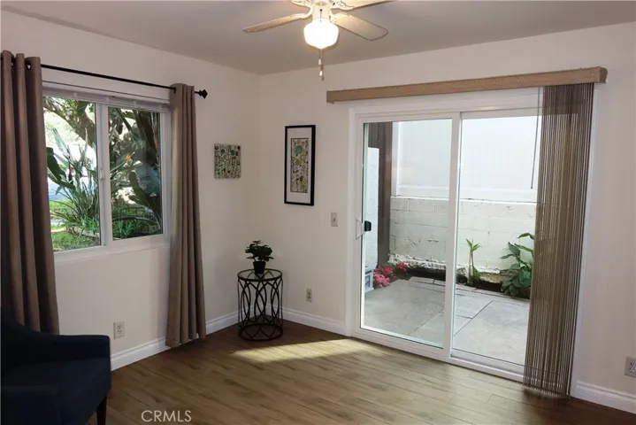 Downstairs bedroom with sliders opening onto patio.