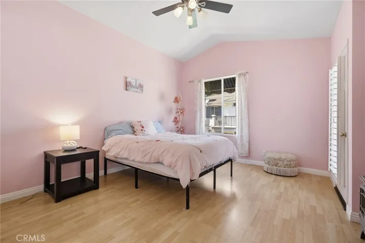 Primary bedroom is huge with vaulted ceilings.