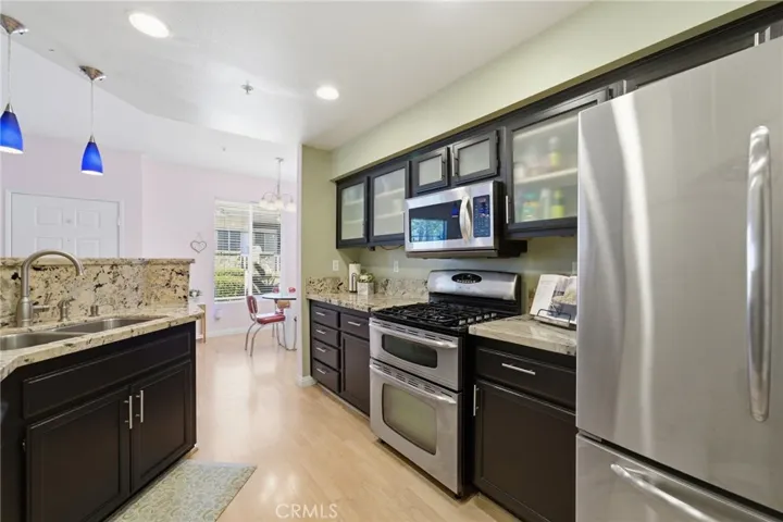 Granite Counter-tops and espresso cabinets.