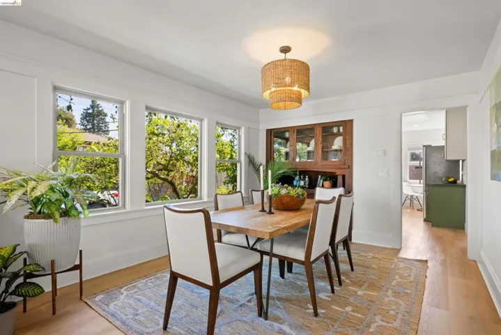Dining room with light wood-type flooring and baseboards