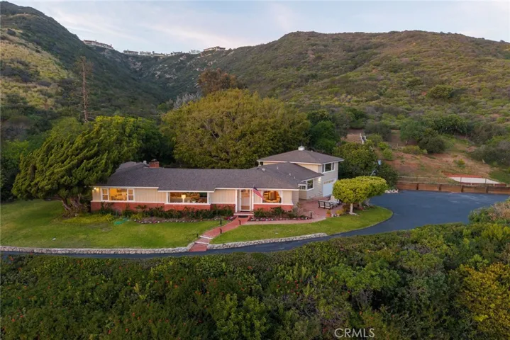 Front of house and property behind going up the​​‌​​​​‌​​‌‌​​‌​​​‌‌​​​‌​​‌‌​​‌‌​​‌‌​​​​ hill.