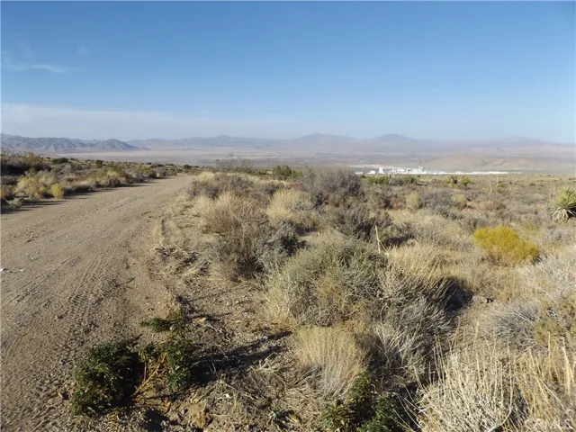 Photo is of property and Mesa Road (when graded, not current state)