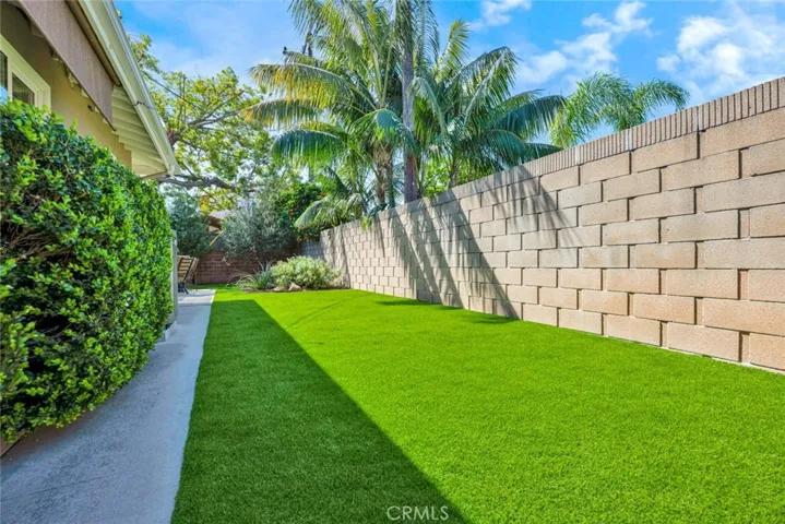 Newly installed artificial grass yard on the side and back yards.