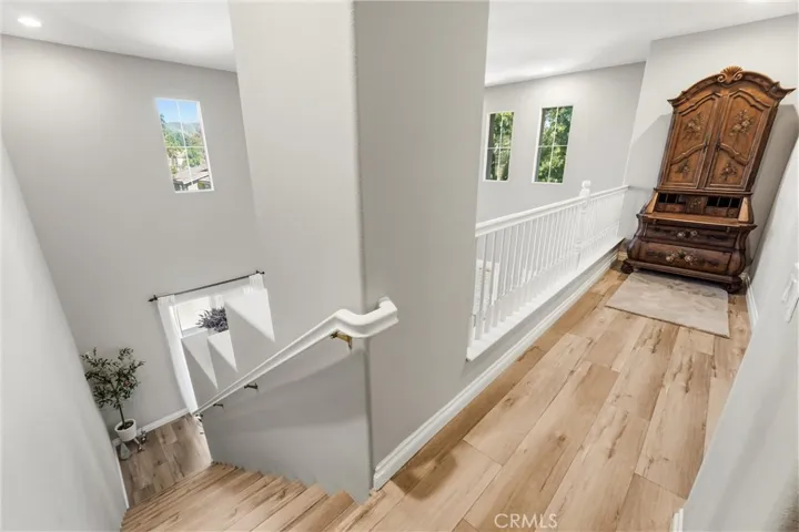 Upper-level stairs and connecting hallway