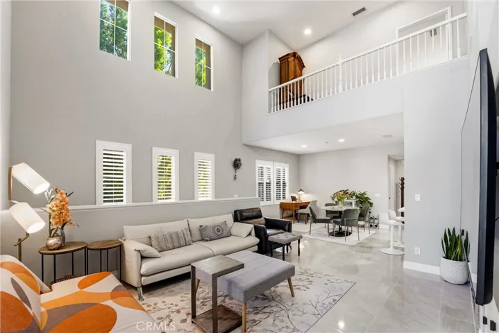 Bright and spacious great room featuring dramatic cathedral ceilings and open upper-level sightlines