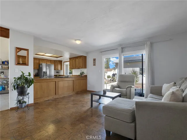 Living Room With View To Kitchen & Slider To Back Yard