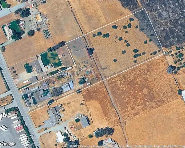 3.870 acres with plenty of room for your imagination. Seasonal creek can be seen thru center of land