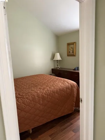 Bedroom featuring dark wood finished floors