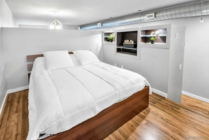 Lofted bedroom with built in storage