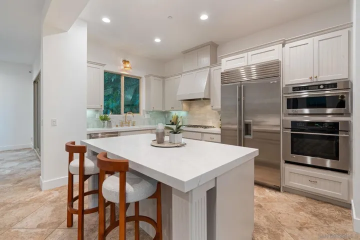 Chef's Kitchen w/Sub Zero Fridge/Freezer, Gas Range, Wall Ovens, and Stainless Dishwasher