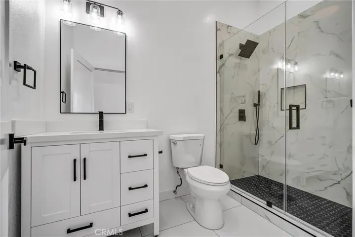 Top floor bathroom located on top of stairs
