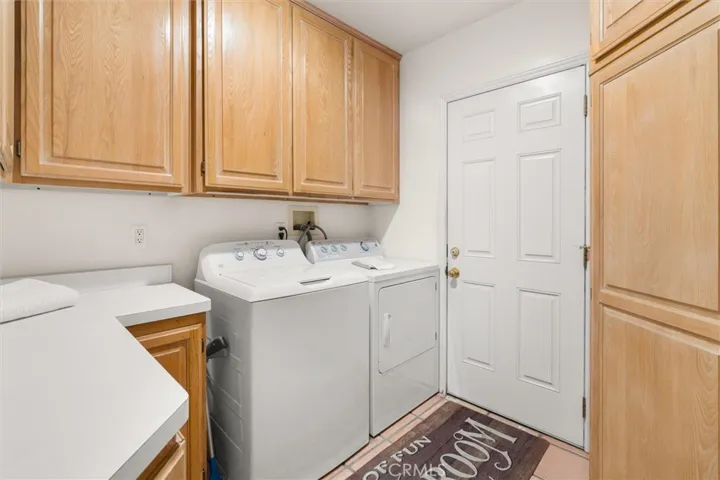 Full laundry room with LOTS of cabinet space.