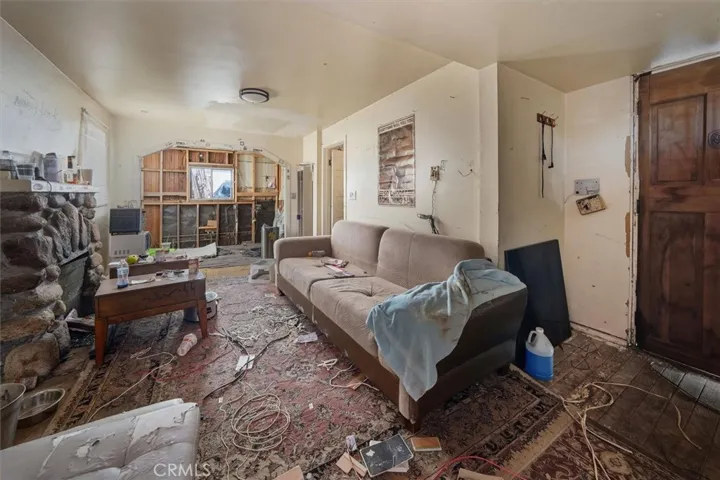 Entrance, Living room in foreground, kitchen in background