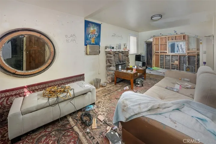 Living room in foreground, kitchen in background
