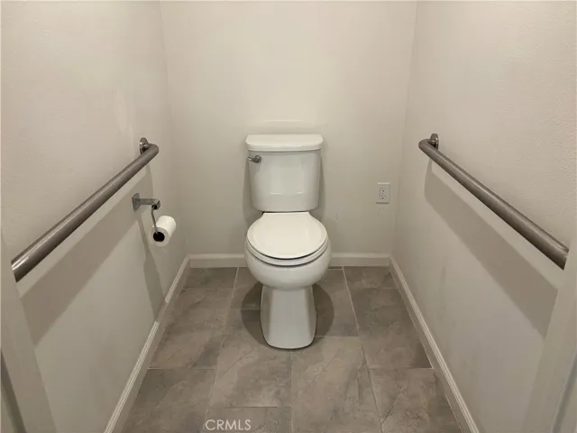 handicap grab bars and an outlet for bidet toilet seat.