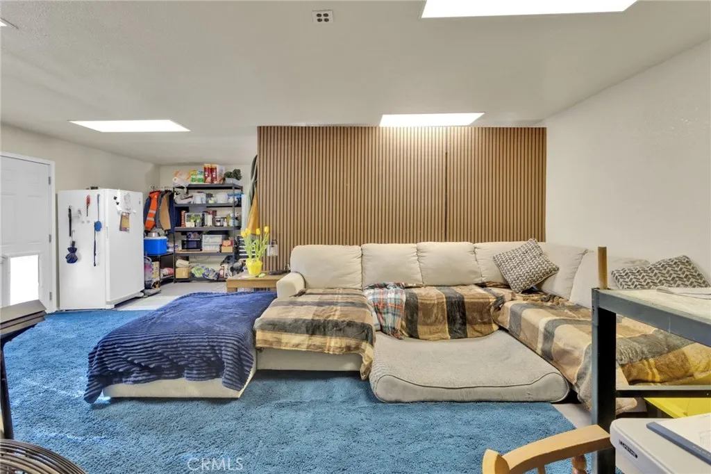 Detached shop featuring a bathroom and living space, offering potential for workshop use, storage, or future conversion.