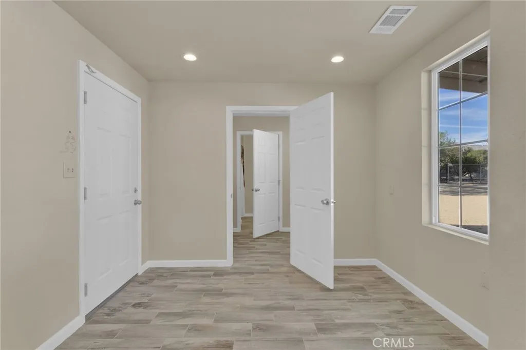 Private office area located on a separate end of the home, offering a quiet and functional space ideal for remote work, study, or additional flex use.